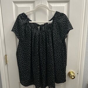 Beautiful black blouse with little white flowers.